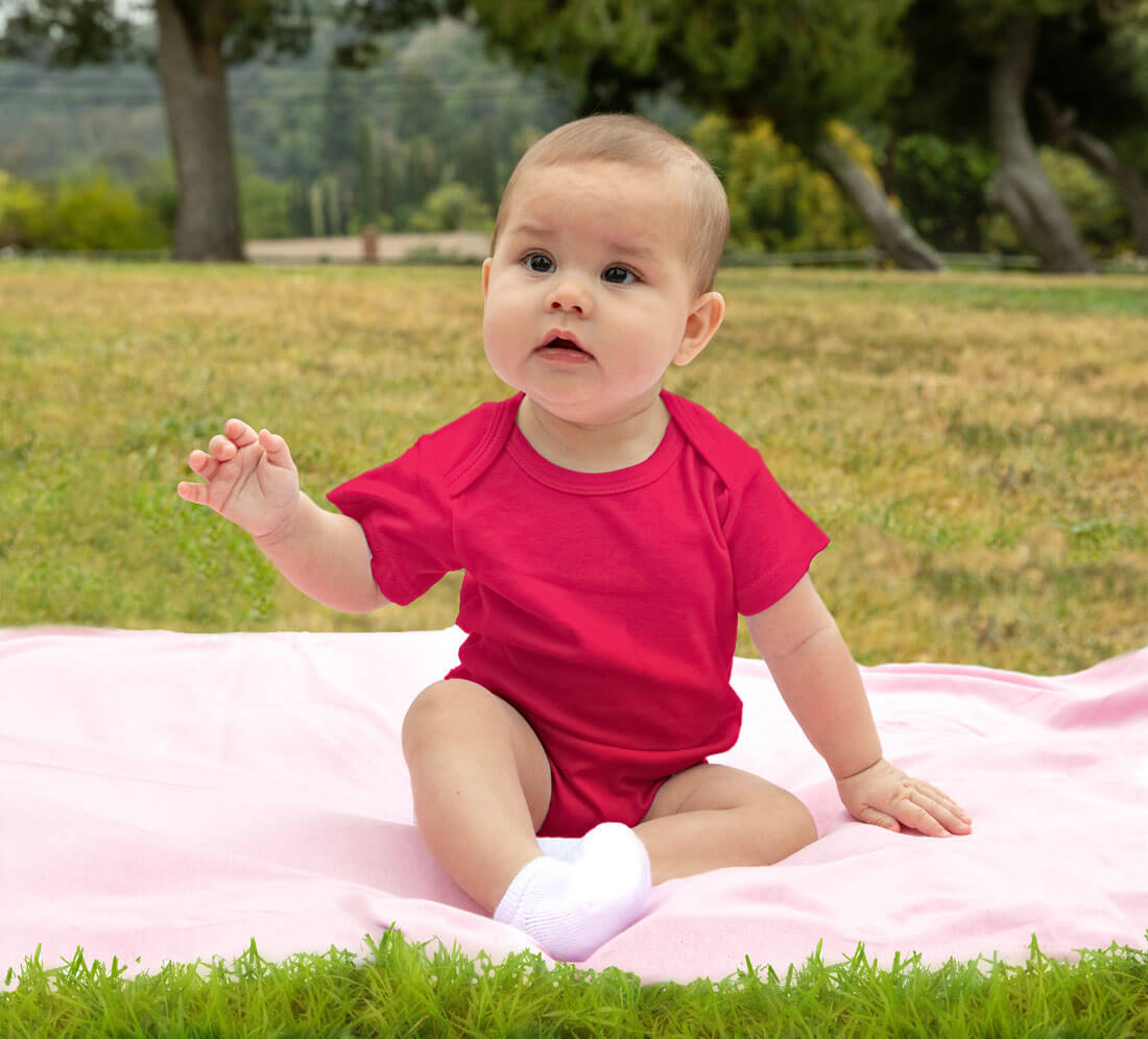 baby wearing hot pink onesie